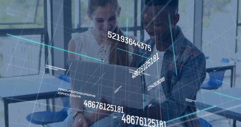 Students Collaborating on Laptop in Digital Classroom