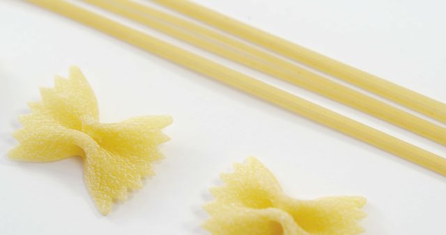 Close-up of Farfalle and Spaghetti Pasta on White Background - Download Free Stock Images Pikwizard.com