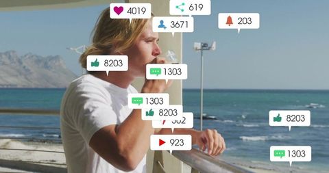 Young Man Enjoying Beach Views with Social Media Interaction