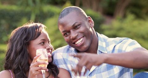 Joyful African American Couple Toasting Outdoors