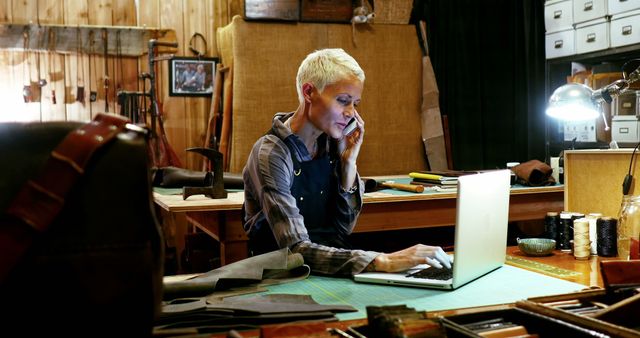 Female Artisan Working in Workshop, Talking on Phone and Using Laptop - Download Free Stock Images Pikwizard.com