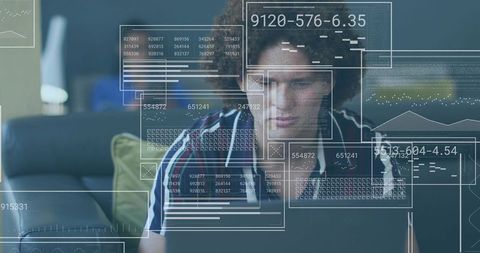 Young Man Analyzing Big Data on Laptop with Floating Dashboard Overlays for Remote Work