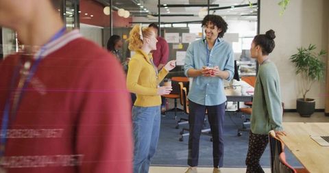 Diverse Team Enjoying Coffee Break in Modern Workspace