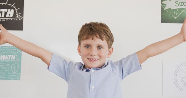 Joyful Young Boy with Open Arms and Happy Smile in Classroom - Download Free Stock Images Pikwizard.com