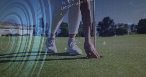 Golfer Retrieving Ball with Digital Overlay on Green