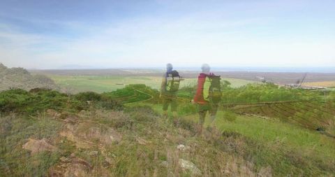 Couple Hiking with Stunning Hillside Farmland View