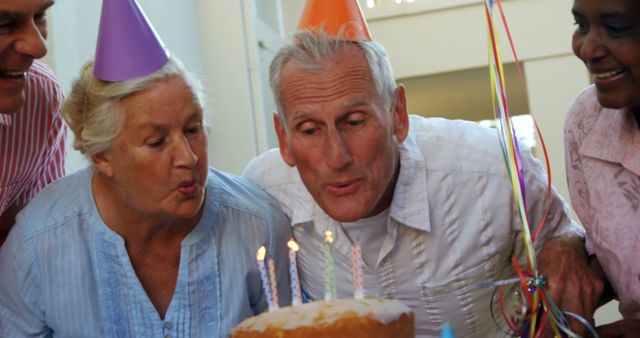 Elderly Friends Celebrating Birthday Party with Cake and Candles - Download Free Stock Images Pikwizard.com