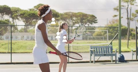 Young athletes practicing tennis on outdoor court