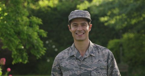 Smiling Caucasian Soldier in Lush Garden - Download Free Stock Images Pikwizard.com