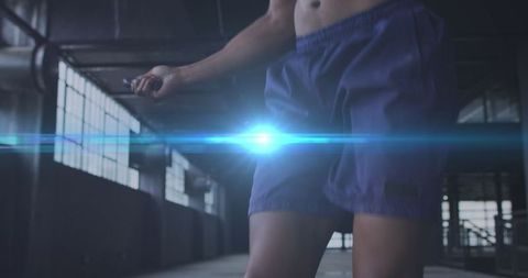 Athletic Man Jumping Rope in Industrial Setting