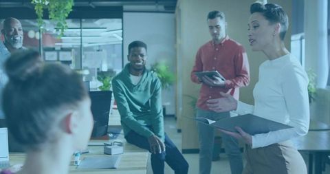 Team Meeting Presentation in Modern Open-Plan Office with Engaged Diverse Colleagues