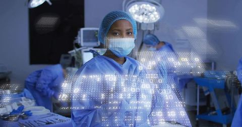 Standing female surgeon wearing mask and cap with digital data overlay in advanced OR