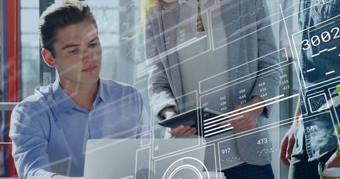 Professionals Collaborating with Digital Data in Office Space