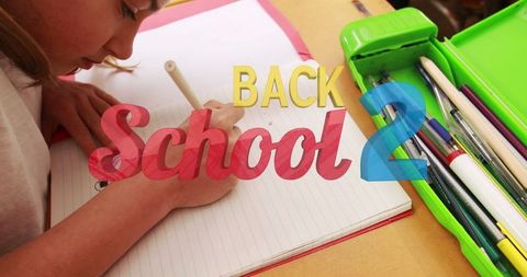 Student writing notebook preparing back to school