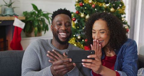 Happy Couple Video Calling Family During Christmas