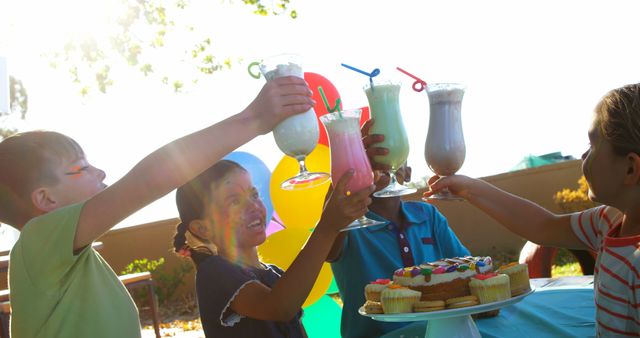 Children Celebrating with Milkshakes Outdoors - Download Free Stock Images Pikwizard.com