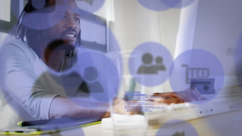 Innovative Business Technology: Man Using Computer with Digital Icons