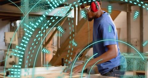 Carpenter Wearing Hearing Protection Operating Table Saw with Digital Precision Overlay