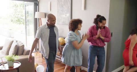 Energetic Friends Arriving at Housewarming Celebration