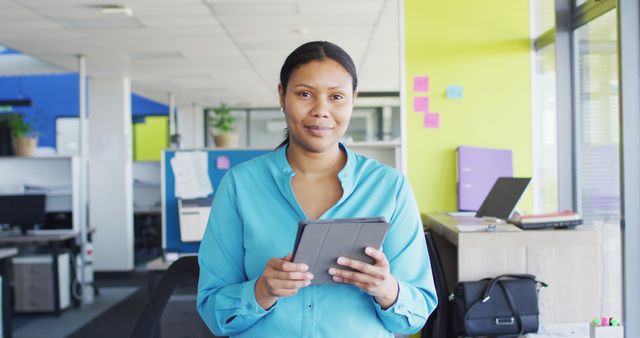 Smiling Businesswoman with Digital Tablet in Modern Office - Download Free Stock Images Pikwizard.com