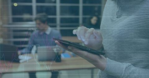 Businesswoman Analyzing Digital Marketing Data on Tablet