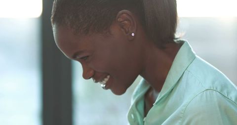 Cheerful young woman smiling in casual environment