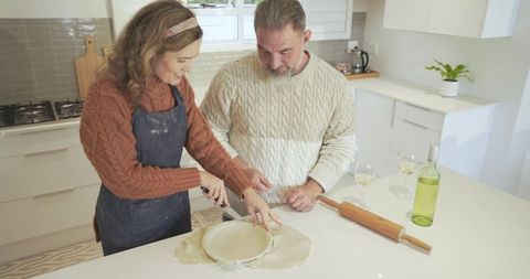 Couple Preparing Pastry Together in Bright Modern Kitchen