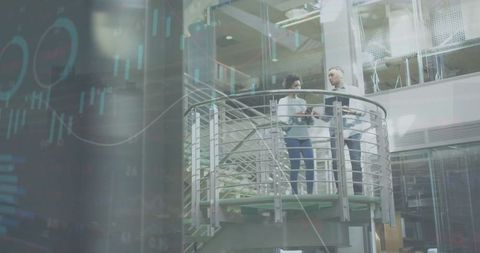 Diverse Business Professionals Collaborating with Financial Data in Modern Office