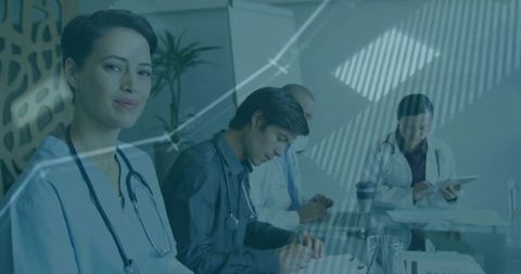 Healthcare Team Collaborating in Hospital Office with Data Analytics Overlay