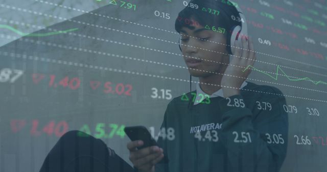 Teen Using Smartphone and Headphones with Stock Market Data Overlay - Download Free Stock Images Pikwizard.com