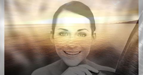 Serene Woman Smiling Over Ocean Sunset Reflection