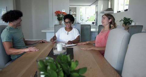 Young couple consulting with advisor at home
