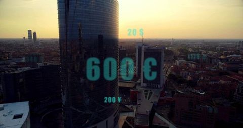 Cylindrical skyscraper with currency symbols at sunset
