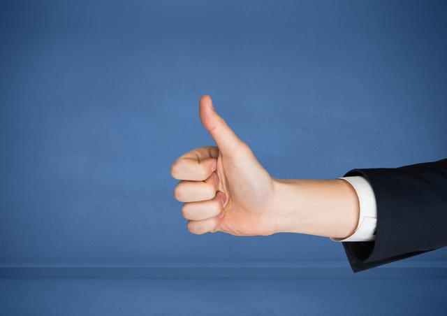 Hand with thumbs up against blue background - Download Free Stock Photos Pikwizard.com