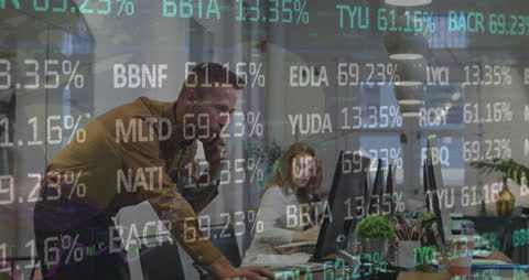 Business Professionals Analyzing Stock Data on Monitors