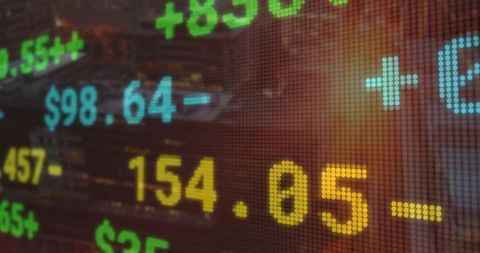 Digital stock market data with urban skyline background