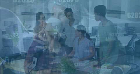 Diverse Team Meeting Discusses Financial Strategy with Data Visualization