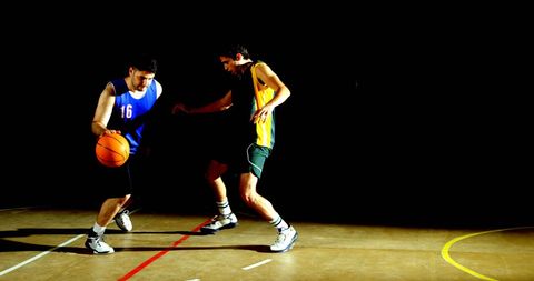 Intense One-on-One Basketball Game Indoors