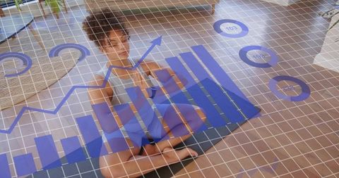 Woman practicing meditation with ar fitness charts overlay for home mindfulness analytics