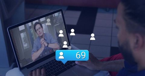 Remote team meeting on laptop hosting video call with notification badge 69 and avatars