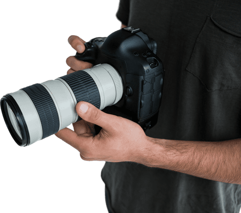 closeup of photographer holding camera with large lens on transparent background - Download Free Stock Videos Pikwizard.com