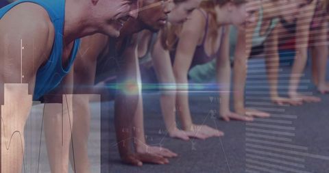 Group doing push-ups in fitness studio with digital overlays showing performance metrics