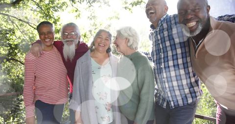 Joyful Senior Group Enjoying Outdoors in Sunlit Garden - Download Free Stock Images Pikwizard.com