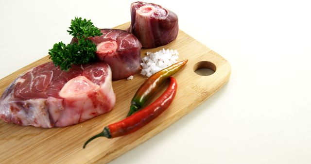 Raw Osso Buco Meat on Cutting Board with Chillies and Salt - Download Free Stock Images Pikwizard.com