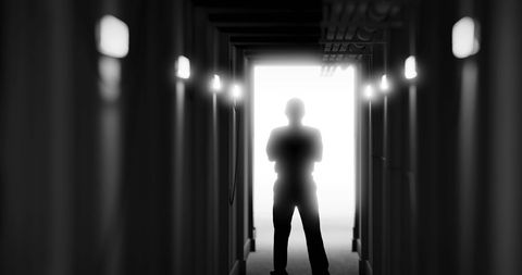 Mysterious silhouette in a dark corridor