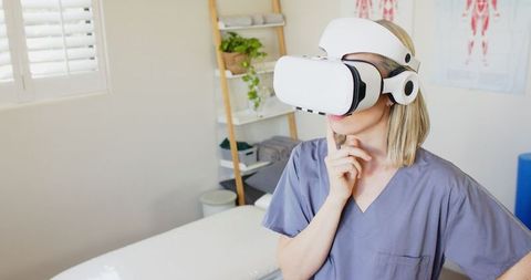 Medical Professional Using VR Technology in Clinic