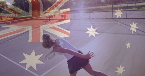 Female tennis player serving on court with faint australian flag overlay