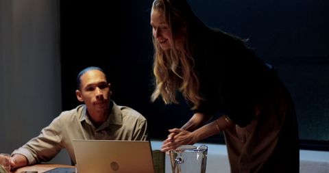 Diverse professionals collaborate at office meeting