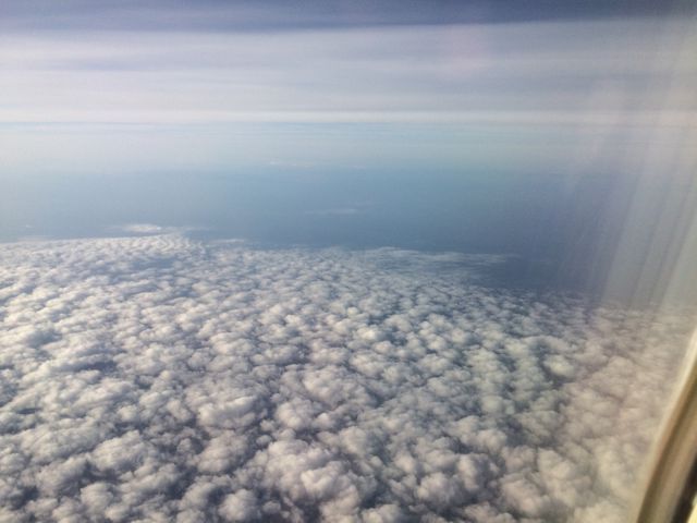 Aerial view of white fluffy clouds and blue horizon - Download Free Stock Images Pikwizard.com
