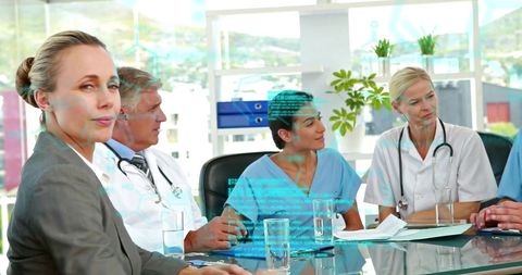 Doctors in Meeting with Digital Interface for Advanced Medical Decision-Making